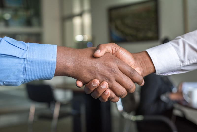 One2Infinite recruitment consultant shaking hands with employer